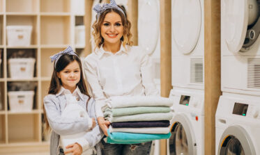 Office cleaning Leeds staff vacuuming a corporate workspace