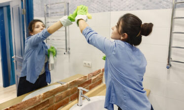 Professional office cleaning Leeds team disinfecting desks